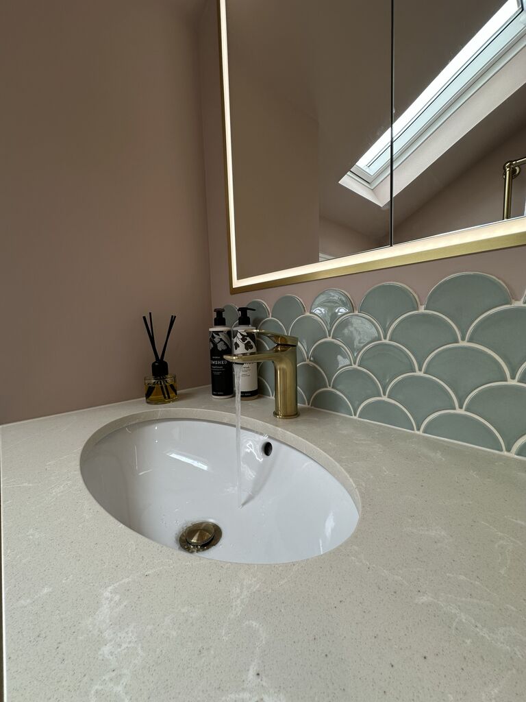 Stone-topped basin, brushed brass tap and sage Ca' Pietra fishscale tiles in a Great Waltham CM3 family bathroom, north of Chelmsford