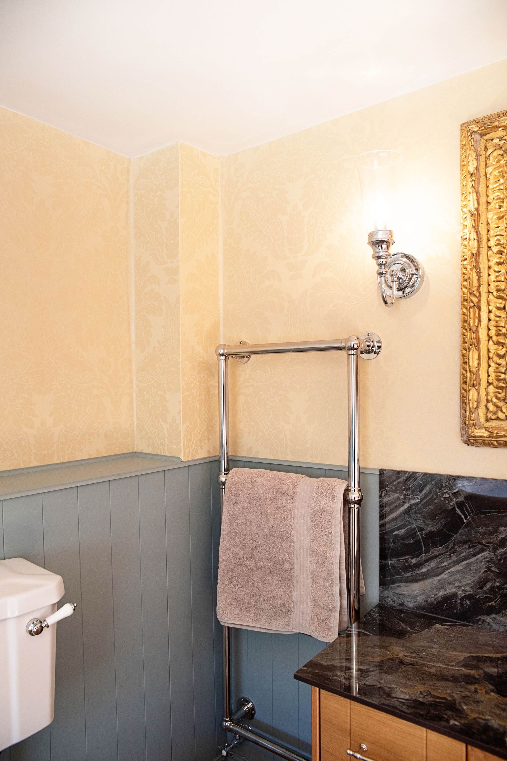 Vogue UK traditional chrome towel radiator with Burlington wall light and blue panelling Halstead CO9