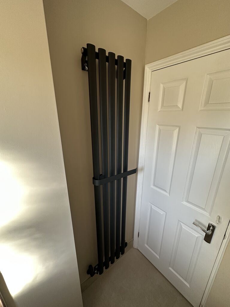 Black vertical radiator in luxury cloakroom Kelvedon CO5 Essex Bowman Bathrooms
