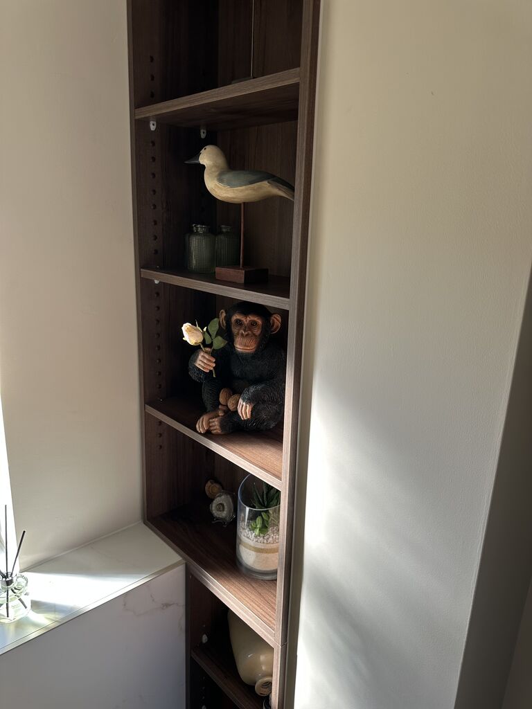 Recessed walnut niche shelving with display styling Kelvedon CO5 Essex cloakroom