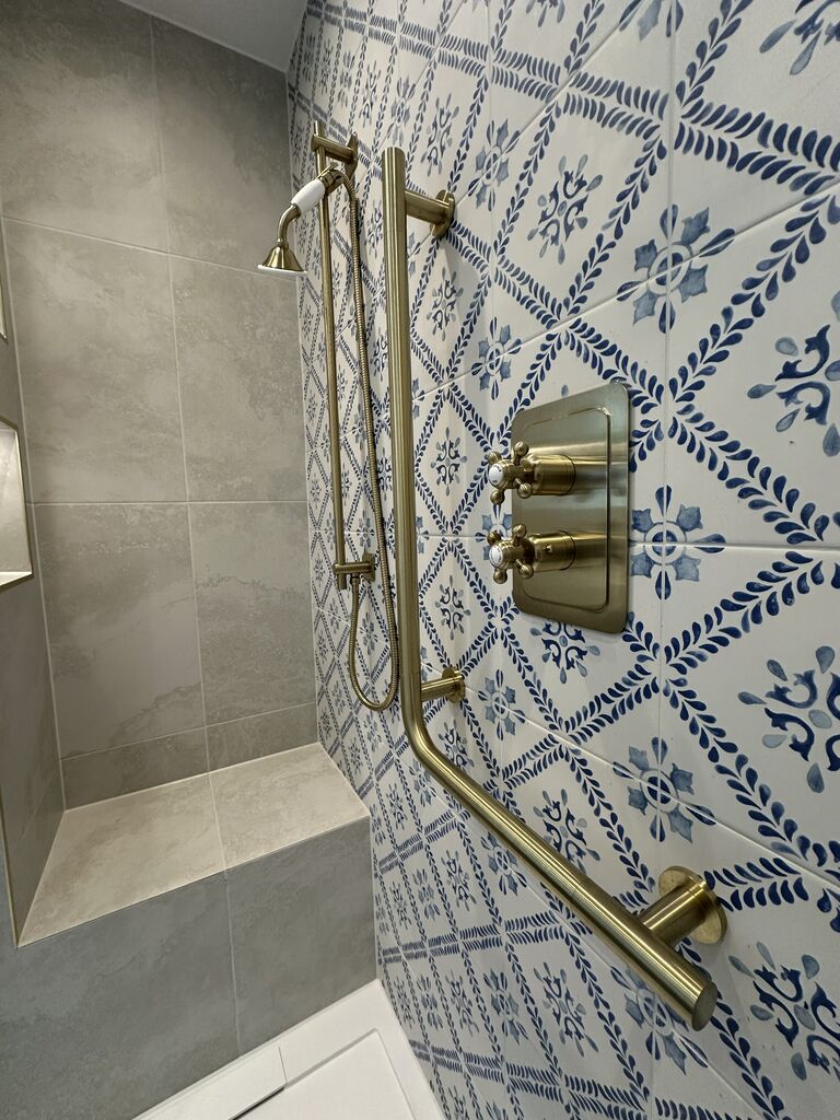 JTP Grosvenor cross-head brushed brass thermostatic shower valve on blue patterned tile Kelvedon CO5 Essex