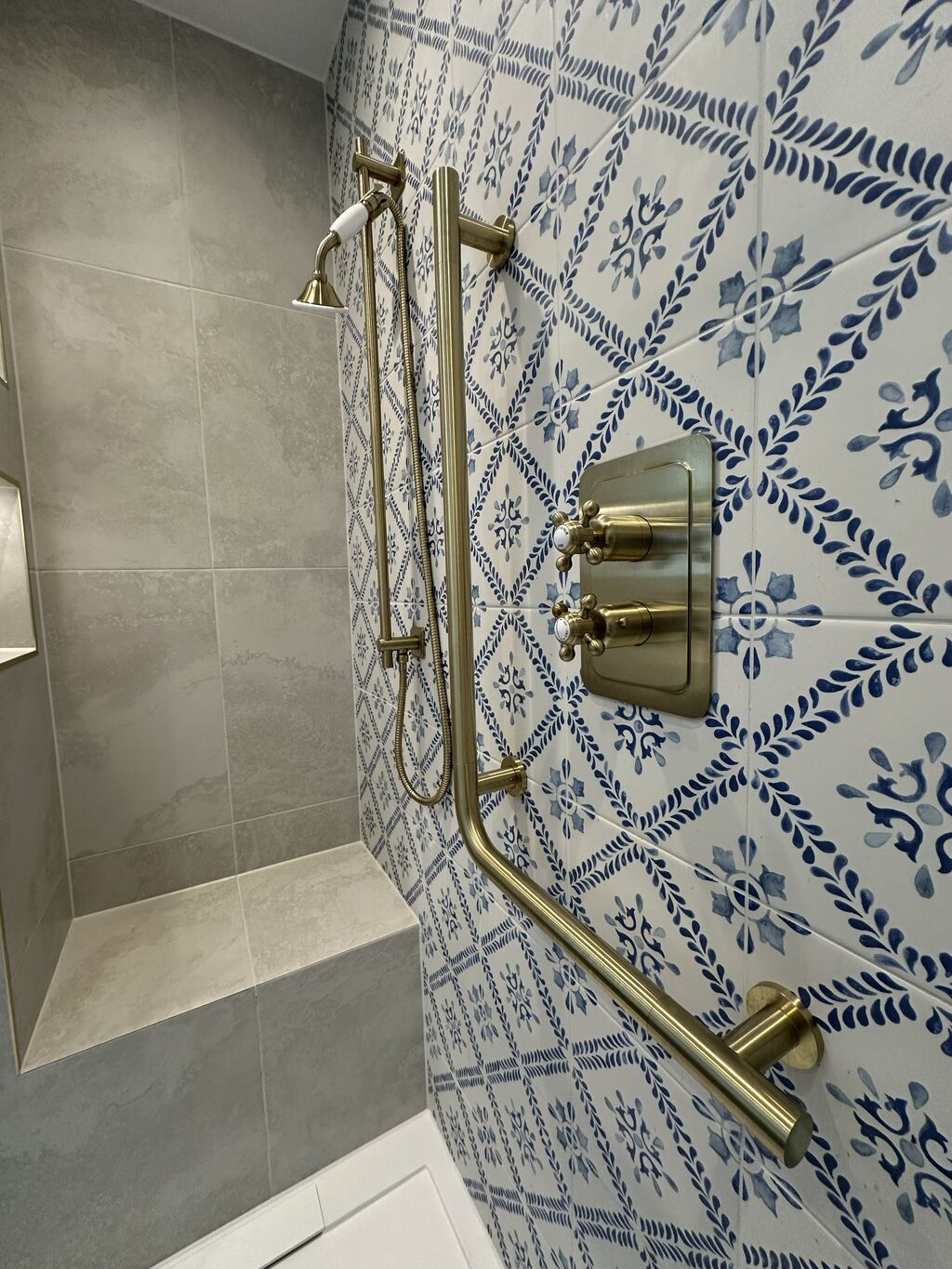 JTP Grosvenor cross-head brushed brass thermostatic shower valve on blue patterned tile Kelvedon CO5 Essex
