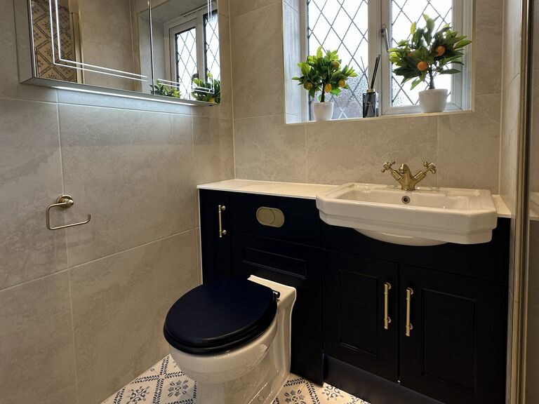 Kelvedon CO5 family shower room with blue patterned tiles and navy fitted furniture