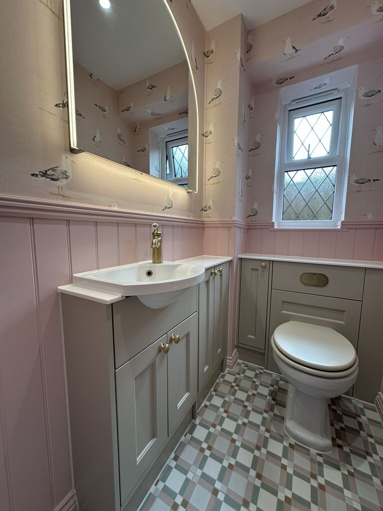Patterned floor tiles running under Calypso Pentland Portland Stone fitted furniture Kelvedon CO5 Essex