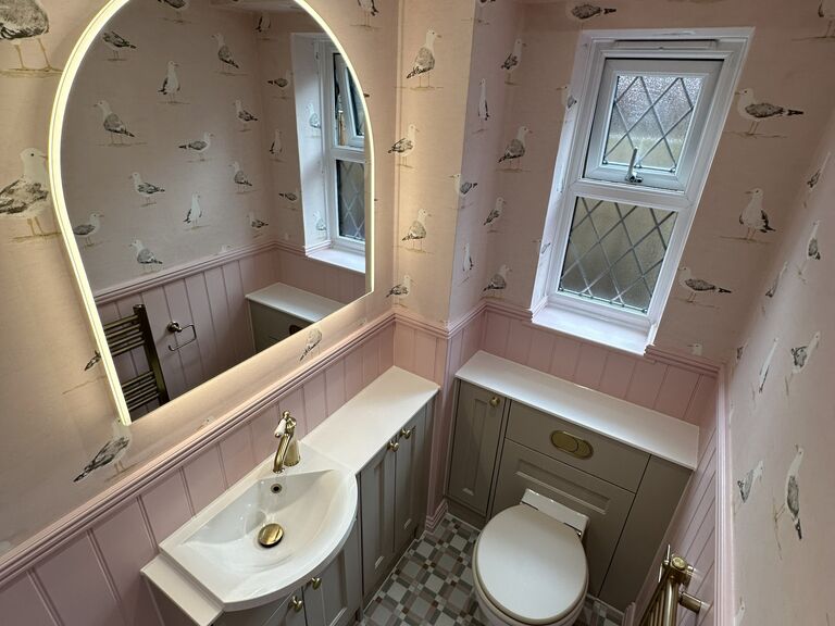 Kelvedon CO5 traditional cloakroom in pink and sage with an arched LED mirror