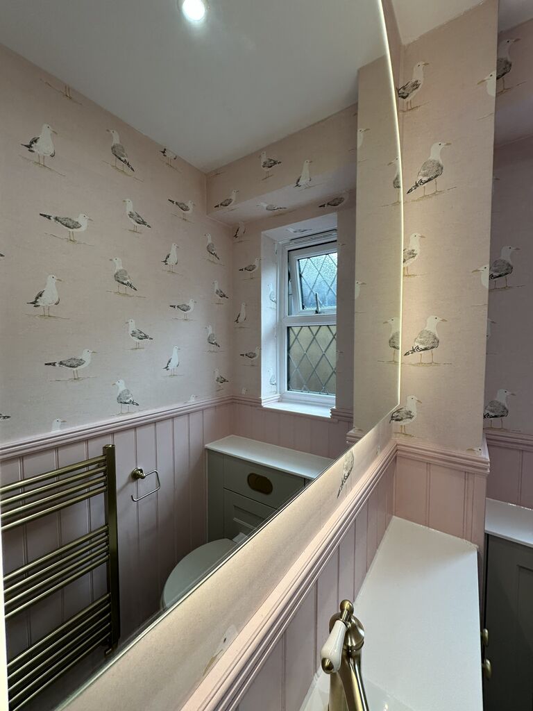 Leaded cottage window above the white worktop in a pink and sage cloakroom Kelvedon CO5 Essex