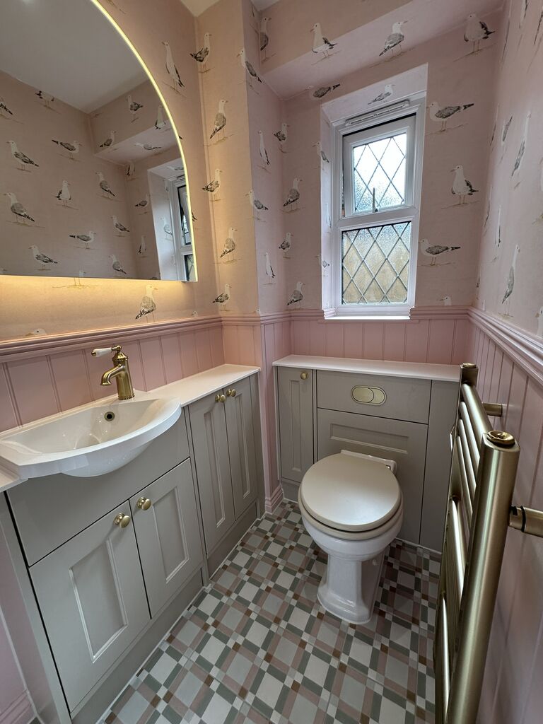 Traditional cloakroom with shorebird wallpaper pink tongue-and-groove panelling and patterned floor Kelvedon CO5 Essex