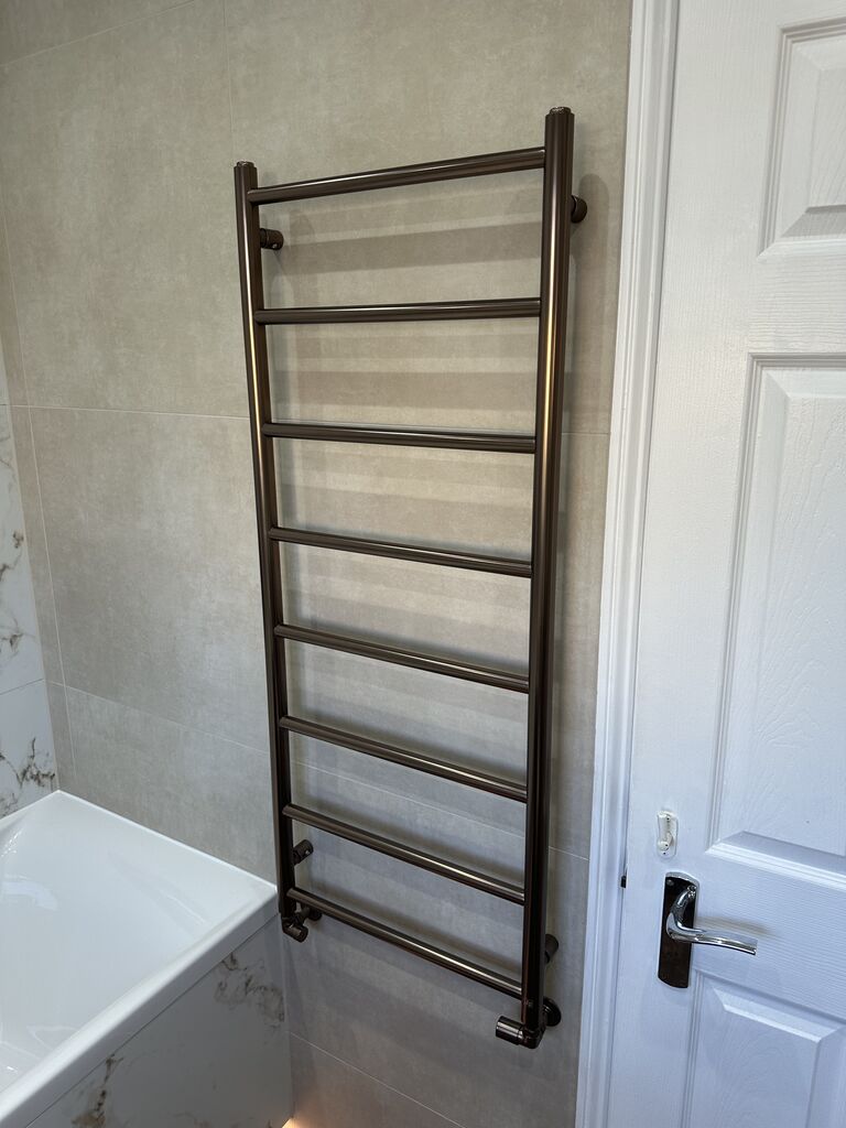 Brushed bronze ladder towel rail in family bathroom Kelvedon CO5 Essex