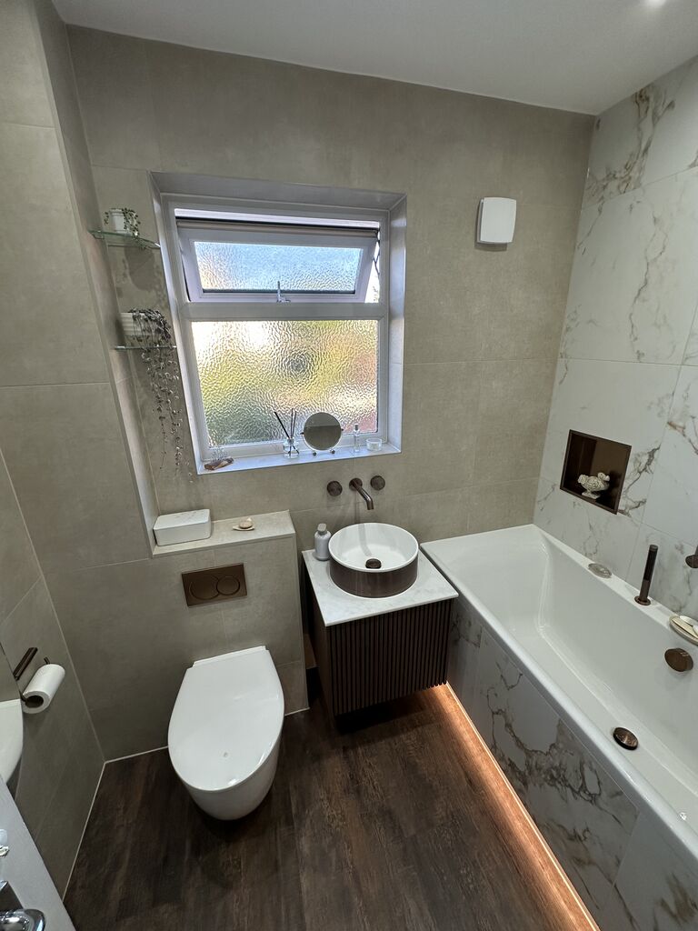 Family bathroom full room with back-to-wall WC fluted vanity and bath Kelvedon CO5 Essex