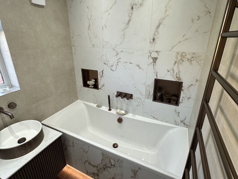 Kelvedon CO5 family bathroom with LED-underlit bath and calacatta feature wall