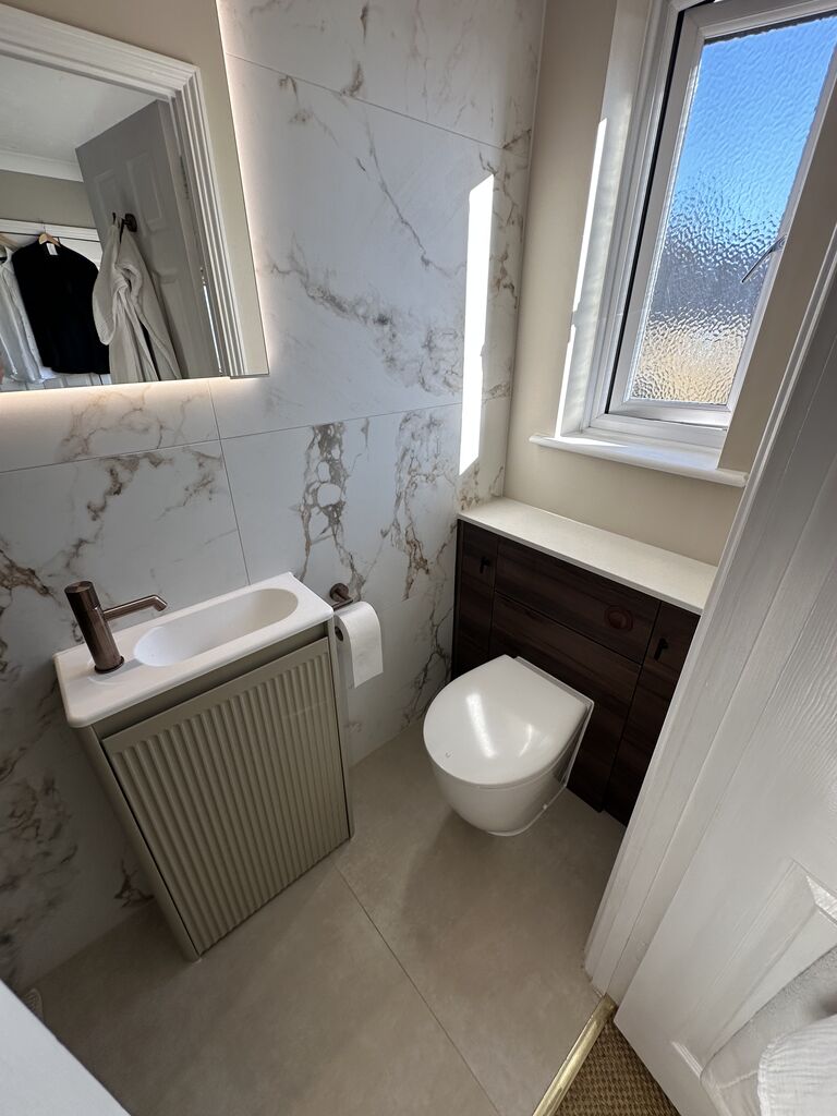 Fluted basin unit with bronze tap WC and backlit mirror Kelvedon CO5 Essex master ensuite Bowman Bathrooms