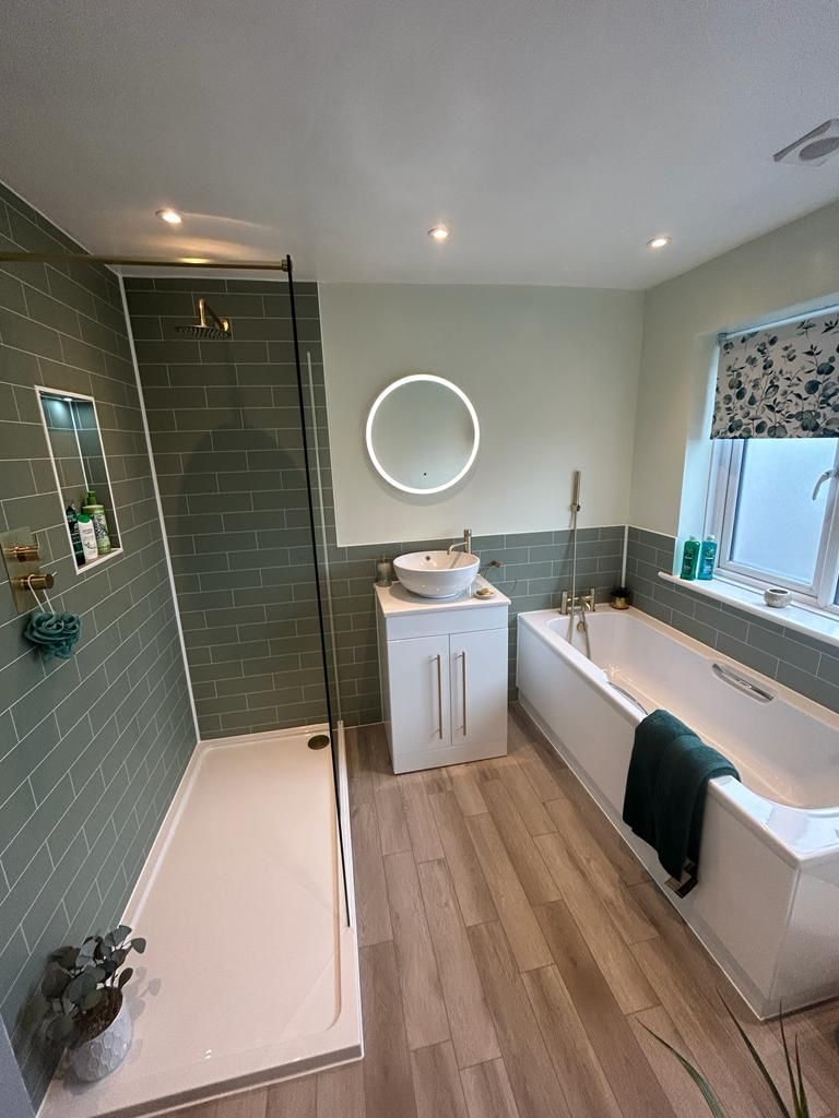 Completed family bathroom with walk-in shower white vanity Carron bath and Amtico wood-effect floor West Mersea CO5