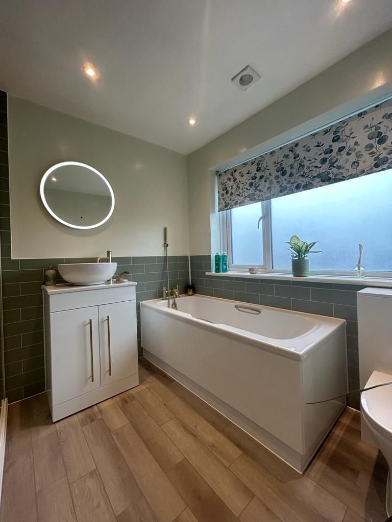 Carron bath white vanity with vessel basin and HiB round LED mirror West Mersea CO5 family bathroom