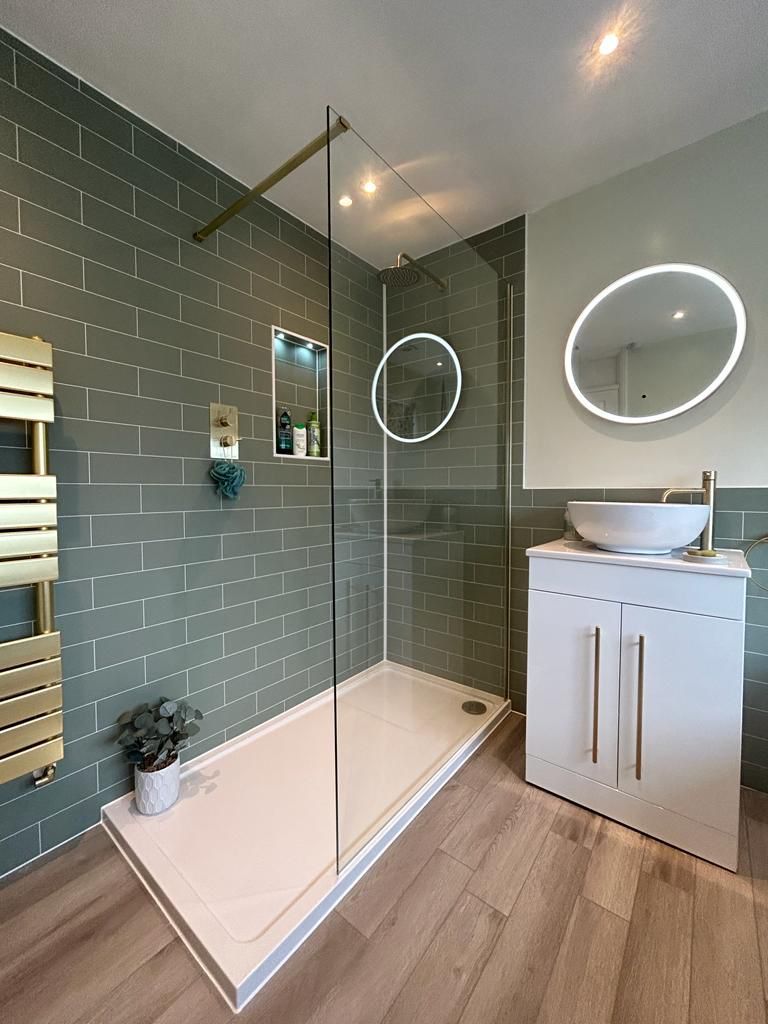 Lakes frameless glass shower screen with Fibo sage panels and recessed storage niche West Mersea CO5