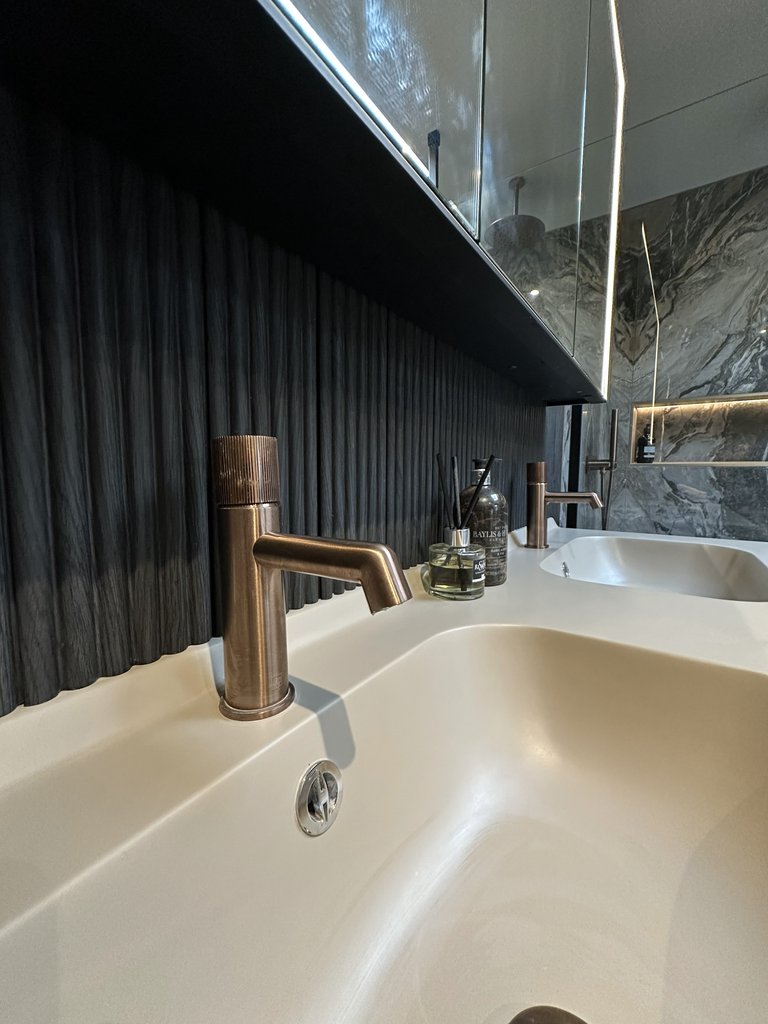 JTP Evo brushed bronze basin mixer on Ambiance Bain vanity with HiB mirrored LED cabinet West Mersea CO5