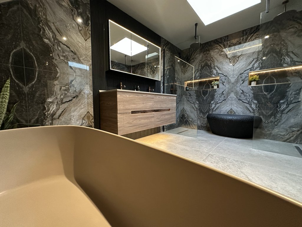 West Mersea CO5 luxury master ensuite with bookmatched marble tiles, freestanding bath and dual rain showers