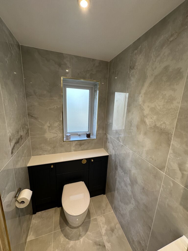 Back-to-wall WC in navy Calypso Chiltern fitted furniture below the window Wickham Bishops CM8 Essex
