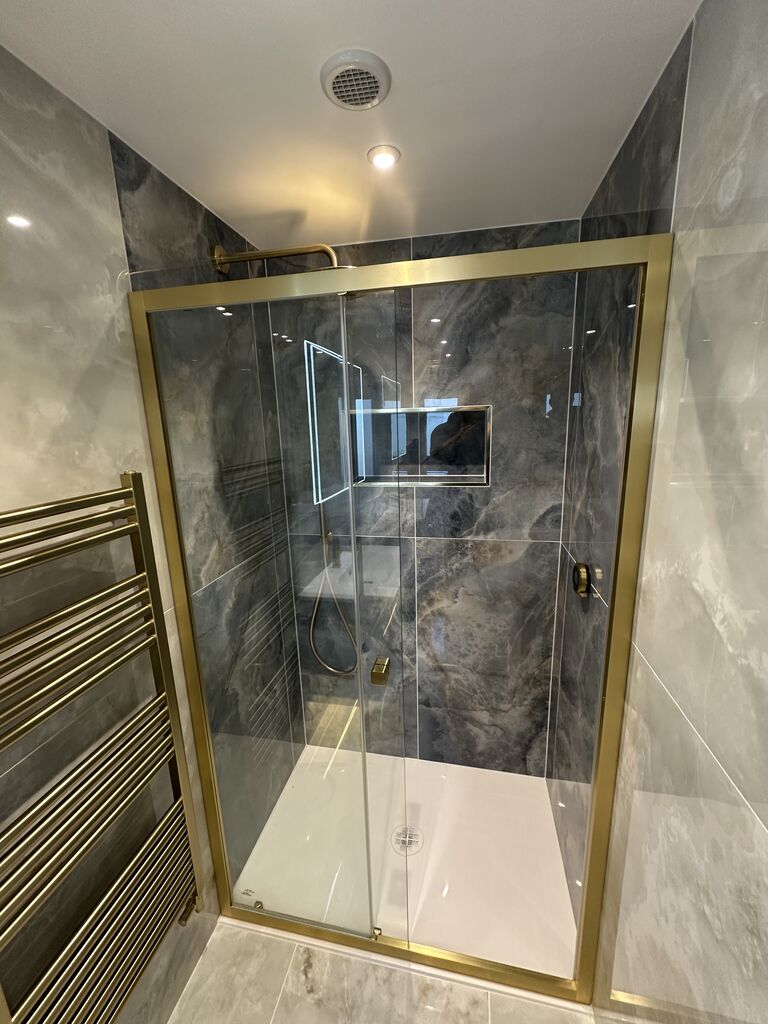 Brushed brass framed shower enclosure with white slate tray in master ensuite Wickham Bishops CM8 Essex